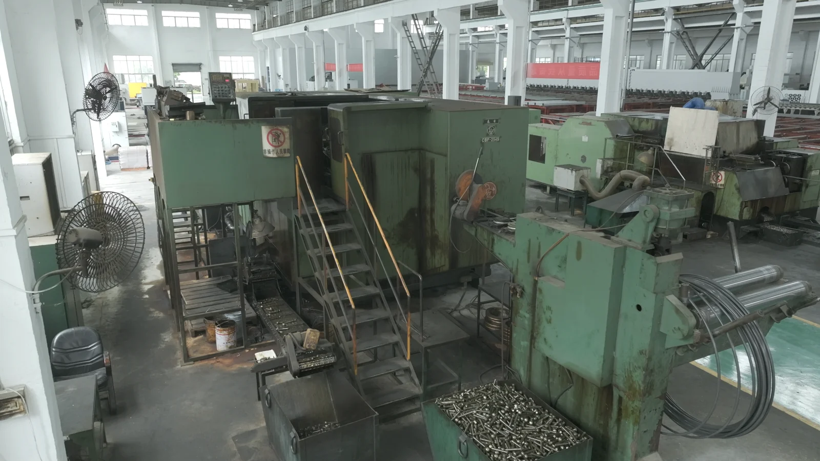 CBF-254S cold heading machine with green enclosure